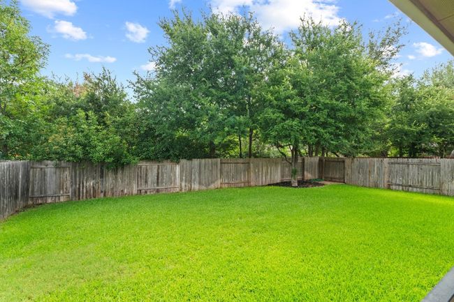 View of fenced backyard | Image 38