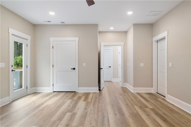 Flex room, game room, theater, or additional large bedroom with exterior access. | Image 27