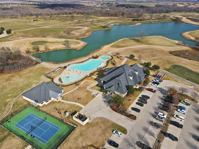 View of property location with a nearby body of water, a pool area, and a golf club | Image 7
