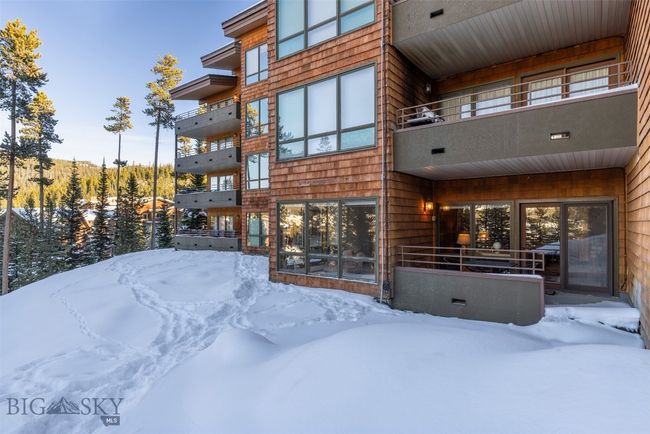 View of snow covered rear of property | Image 35