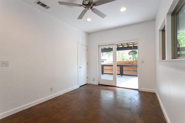 Spare room with finished concrete flooring, recessed lighting, and a ceiling fan | Image 14