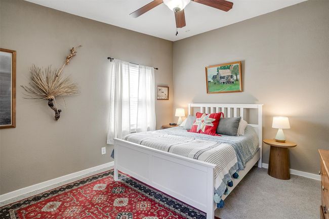 Carpeted bedroom featuring baseboards and ceiling fan | Image 15