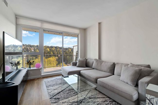Living room featuring visible vents and light wood-style flooring | Image 9