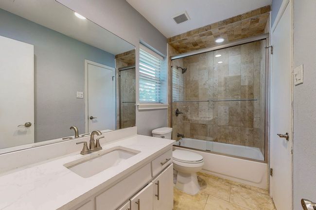 Full bath with enclosed tub / shower combo and is shared by two BRs on second floor | Image 15
