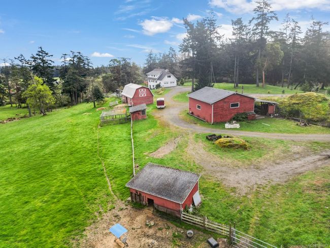 View of subject property with a tree filled landscape | Image 44