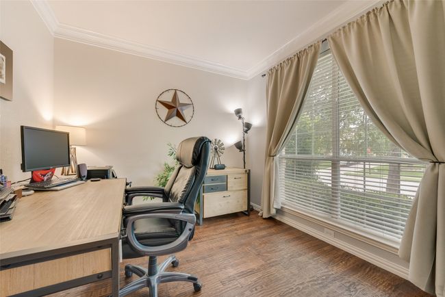 Office featuring ornamental molding, dark wood finished floors, and baseboards | Image 6