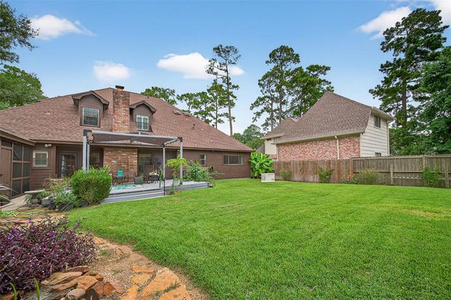 The yard is fully fenced and thoughtfully landscaped, offering color, texture, and a calming retreat. The perfect backdrop for garden projects or lazy afternoons. | Image 47