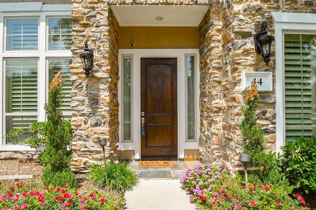 Gorgeous rustic stacked stone lines the front porch | Image 6