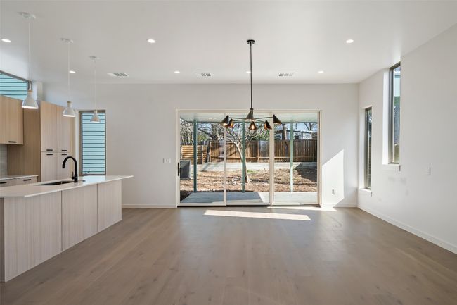 Dining space with light wood-type flooring, visible vents, and recessed lighting | Image 7