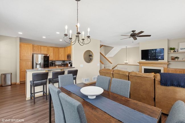 A view of the main level dining room, kitchen and living room | Image 13