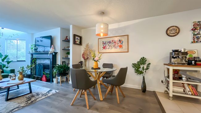 Dining space featuring a fireplace | Image 4