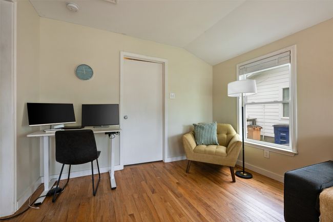 Living room has space for an office nook. | Image 24