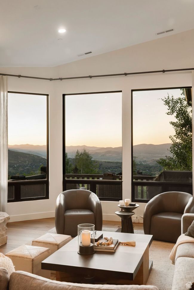 Living room with a mountain view, light wood-type flooring, and recessed lighting | Image 22