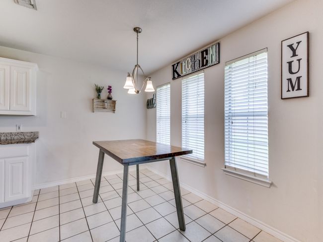 Dining space featuring baseboards and light tile patterned floors | Image 16