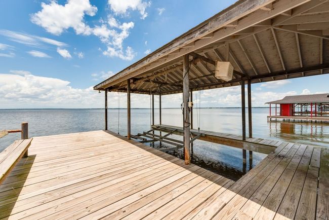 You'll have lots of decking space if you wanted to add in a deck set for relaxing right at the water. | Image 34