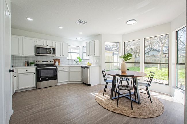 Remodeled kitchen with natural lighting. | Image 6