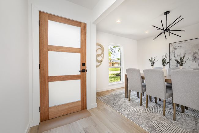 Dining area with recessed lighting, light wood-style flooring, baseboards, and an inviting chandelier | Image 11