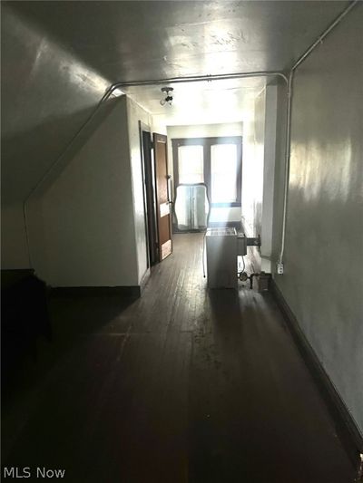 Hallway featuring dark wood-type flooring | Image 2