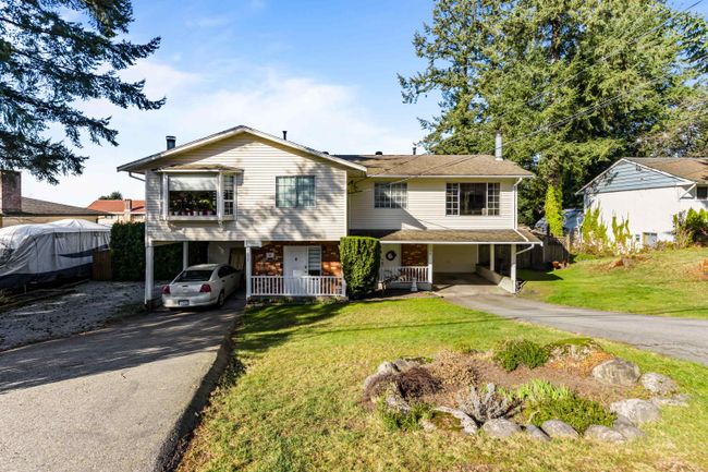 434 Mundy Street, Home with 4 bedrooms, 2 bathrooms and 3 parking in Coquitlam BC | Image 2