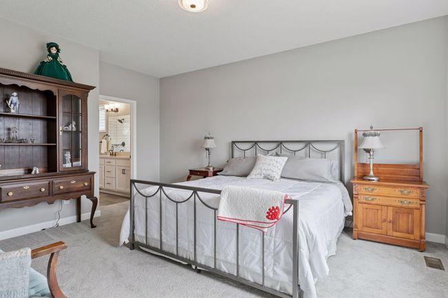 Luurious main floor living with high ceilings and plenty of main floor primary bedroom space | Image 26