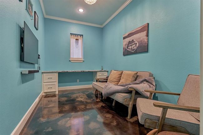 Tucked away just off the mudroom, this flexible space offers the perfect level of privacy—ideal for a home office, study area, or a dedicated gaming room for teens. | Image 13