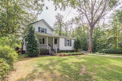 Country Charm awaits you, front porch to sit on | Image 1