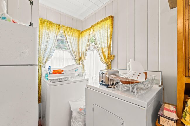 Laundry area with washing machine and dryer | Image 11