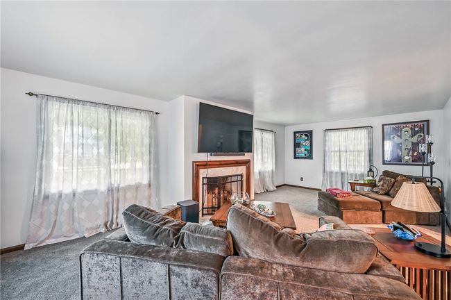 A spacious living area designed for comfort. | Image 22