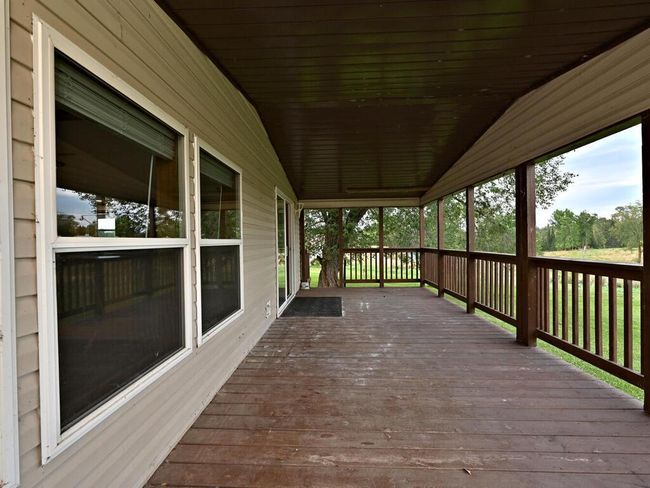 Covered porch perfect for morning coffee or end of the day relaxing | Image 4