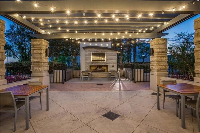 Pool deck fireplace and TV | Image 14