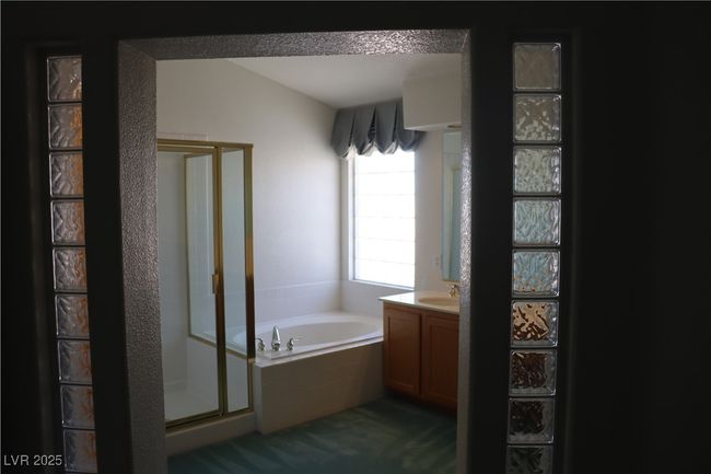 Full bath with vanity, a stall shower, and a garden tub | Image 45