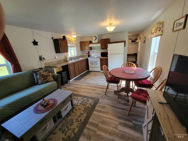 Living area with wood finished floors | Image 32