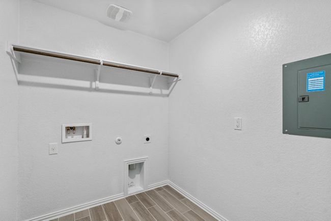 Laundry area featuring electric panel, hookup for a gas dryer, laundry area, hookup for an electric dryer, and hookup for a washing machine | Image 23