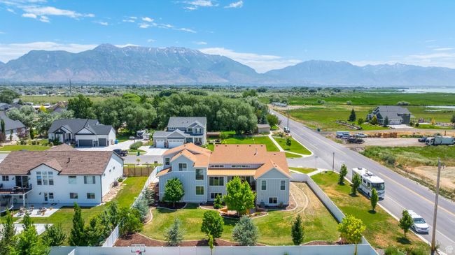 Aerial view of residential area featuring a mountainous background | Image 40