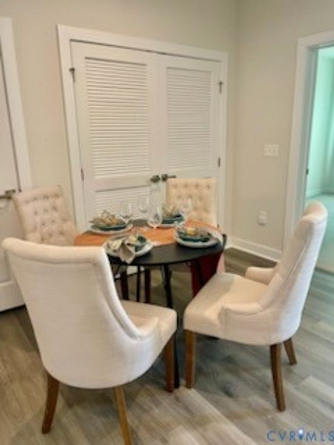 Dining area with wood finished floors | Image 10