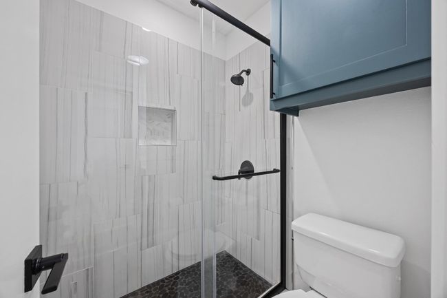 Bathroom featuring a stall shower | Image 20