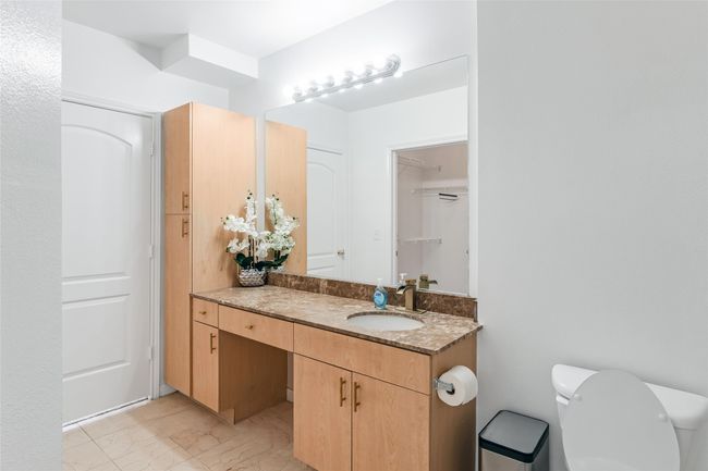 Bathroom featuring vanity and marble look tile flooring | Image 26