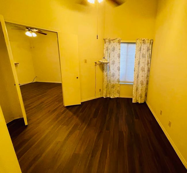 Unfurnished room featuring ceiling fan and wood finished floors | Image 9