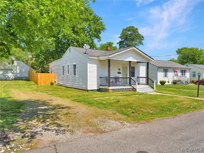 View of front facade with a front yard and a porch | Image 3