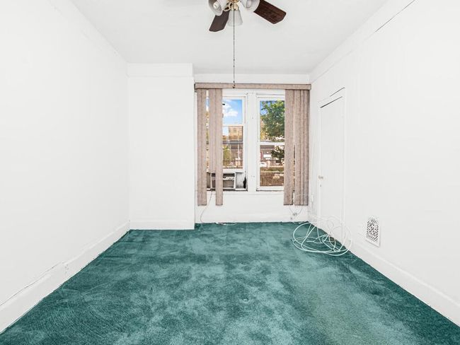 Unfurnished room featuring carpet, visible vents, a ceiling fan, and baseboards | Image 12