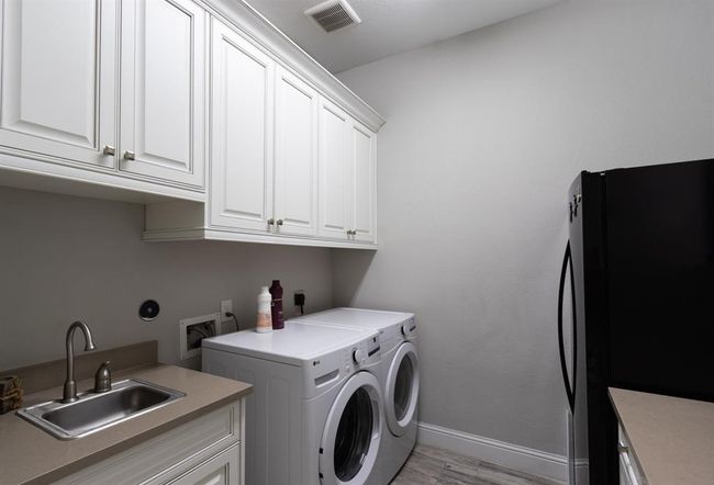 Laundry with utility sink | Image 41