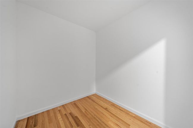 Unfurnished room featuring baseboards and light wood-style floors | Image 19
