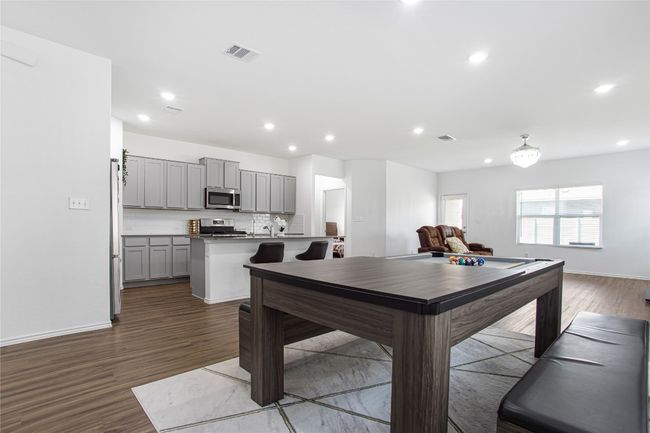 Dining room with baseboards, dark wood-style flooring, visible vents, and recessed lighting | Image 7