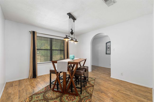 Dining room with arched doorways | Image 17