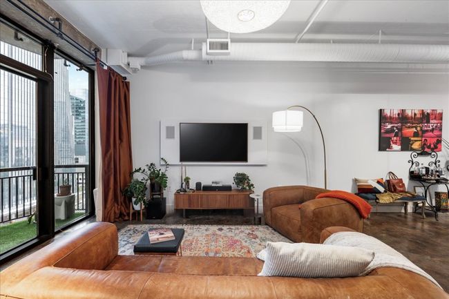 Living room with finished concrete flooring | Image 13