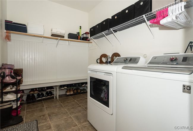 Washroom with independent washer and dryer, laundry area, and tile patterned floors | Image 16
