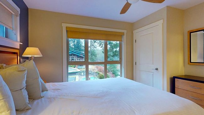 Bedroom with a ceiling fan | Image 26