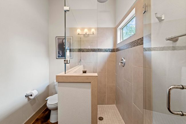 Full bathroom with toilet, a stall shower, and baseboards | Image 13