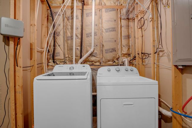 Laundry area with washer and clothes dryer and electric panel | Image 27