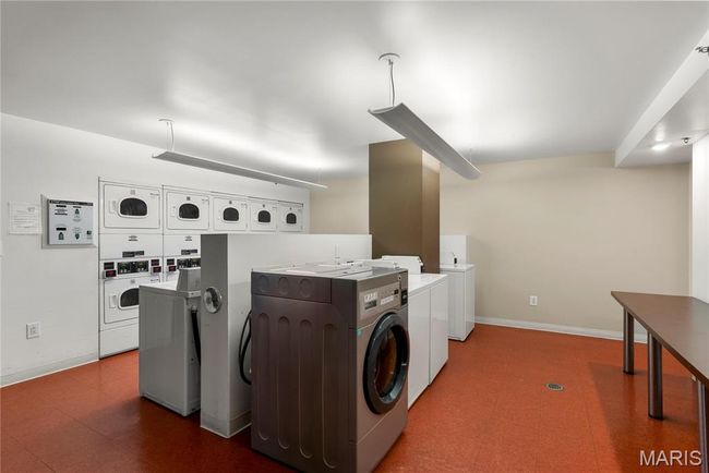 Community laundry room featuring stacked washer / drying machine, washing machine and clothes dryer | Image 31